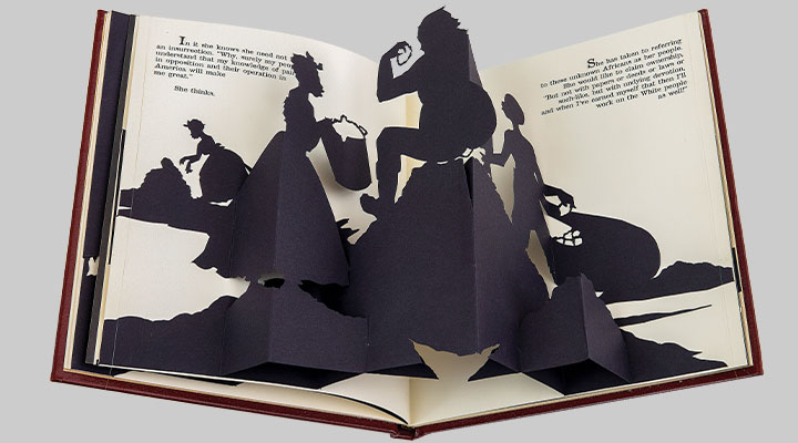 A pop-up book of silhoutted characters